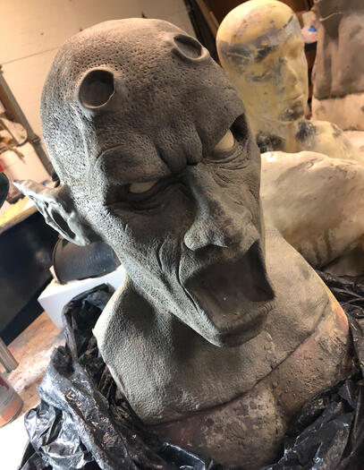 Unfinished orc sculpture in water-based clay